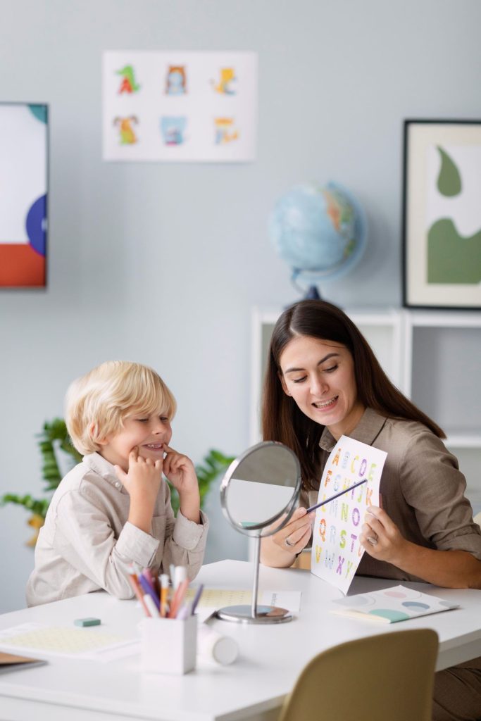 A teacher doing a tutorial lesson to her student.